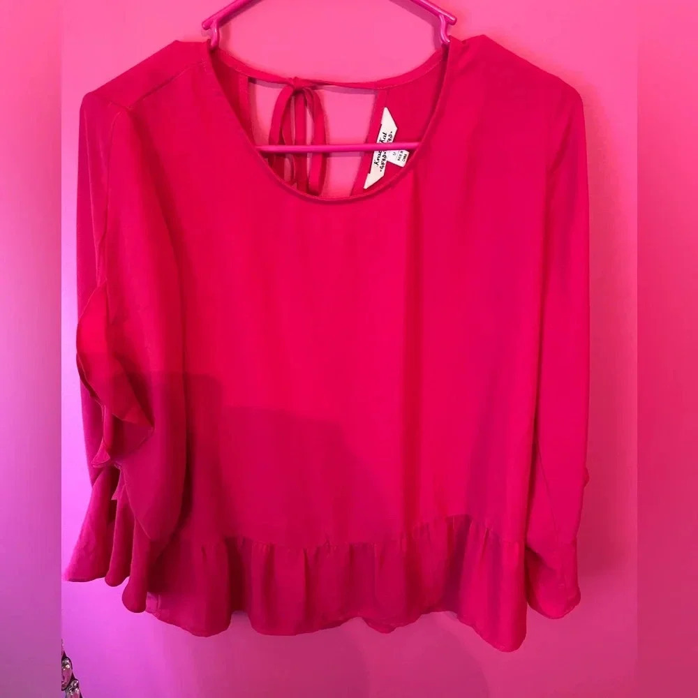 Pink blouse with ruffles
